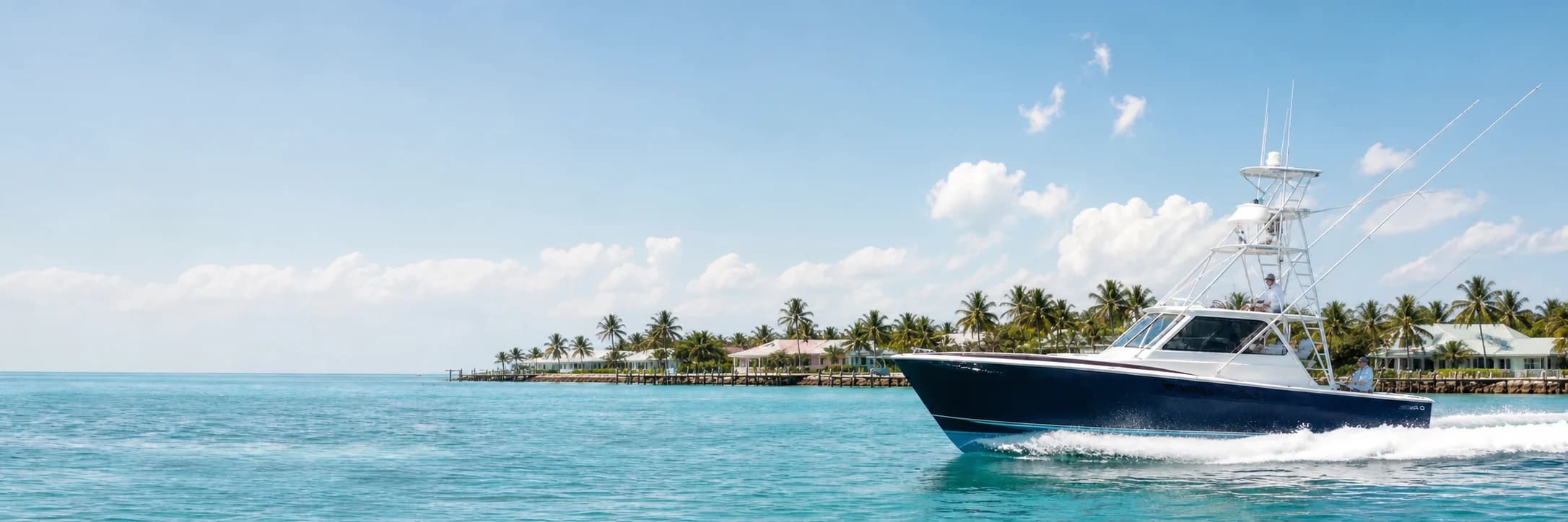 Sportfishing charter boat cruising on clear turquoise water
